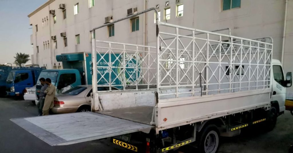: Pickup truck loading furniture for rental service in Dubai