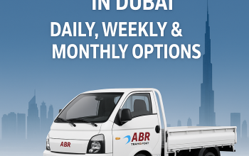 White pickup truck in Dubai with ABR Transport logo and skyline in background